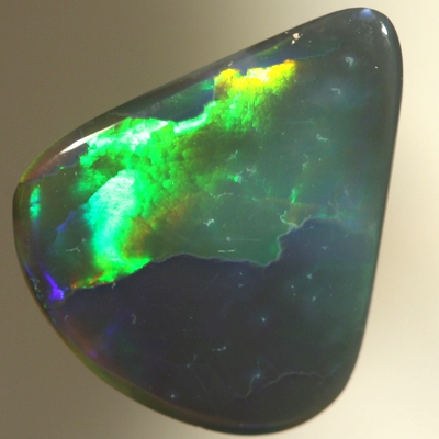 SOLID BLACK OPAL Two large rolling flashes of neon greens to ultra violet. SEE VIDEO